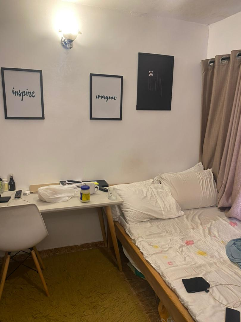 Single room with inspire and imagine wall art at Rilwan AJALA Homes